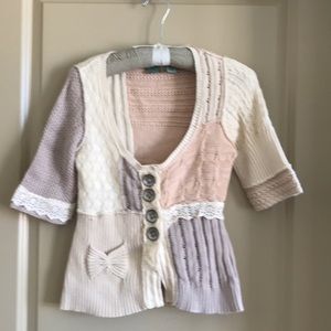 Hip length button front cotton sweater